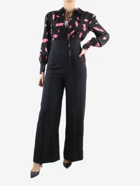 Black lips printed long-sleeved jumpsuit - size UK 8